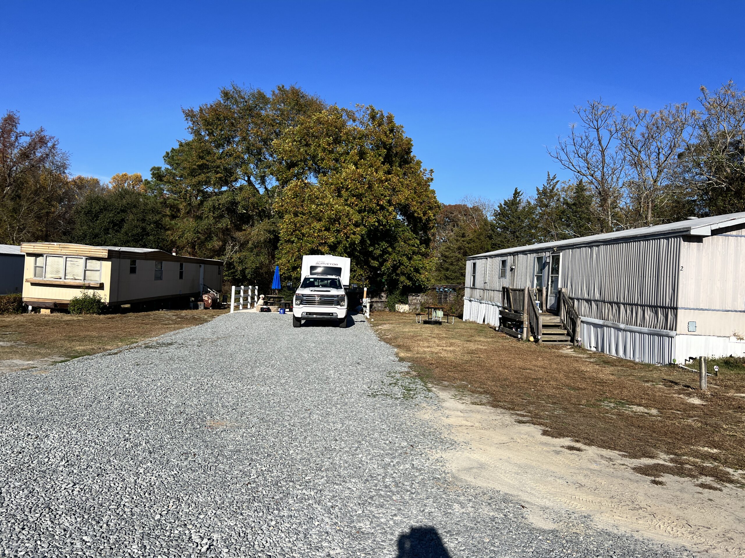 Our travel trailer at Four Oaks in between two run down mobile homes